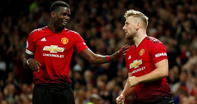 Soccer Football - Premier League - Manchester United v Leicester City - Old Trafford, Manchester, Britain - August 10, 2018 Manchester United's Luke Shaw celebrates scoring their second goal with Paul Pogba Action Images via Reuters/Andrew Boyers EDITORIAL USE ONLY. No use with unauthorized audio, video, data, fixture lists, club/league logos or "live" services. Online in-match use limited to 75 images, no video emulation. No use in betting, games or single club/league/player publications. Please contact your account representative for further details.